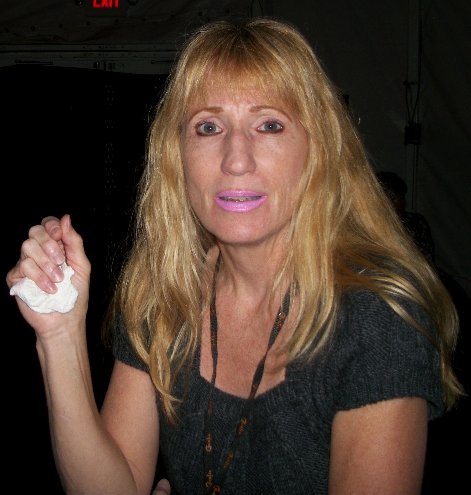 Patti Deutsch holding a piece of tissue while wearing a sleeve